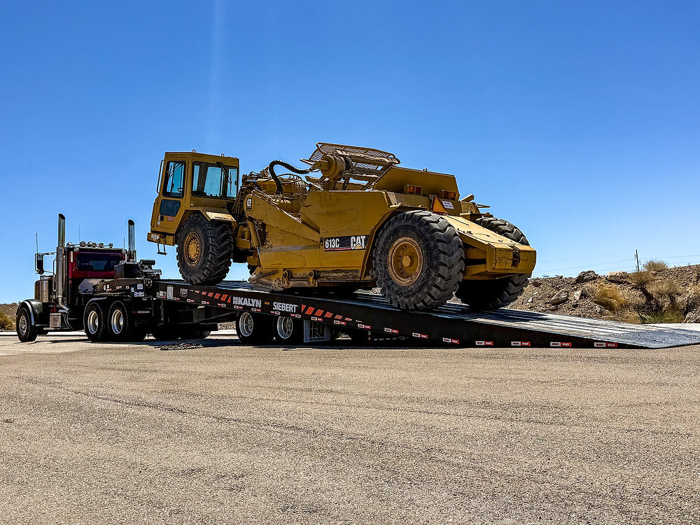 Flatbed landoll trailer carrying freight